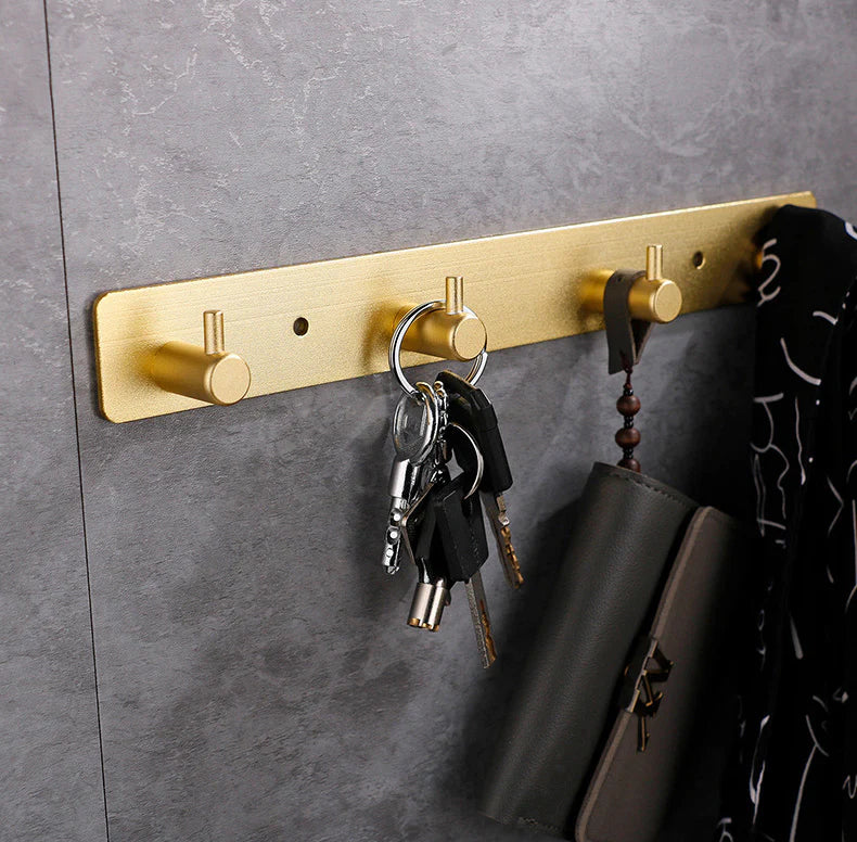 Tringle murale avec 2 crochet Dorée